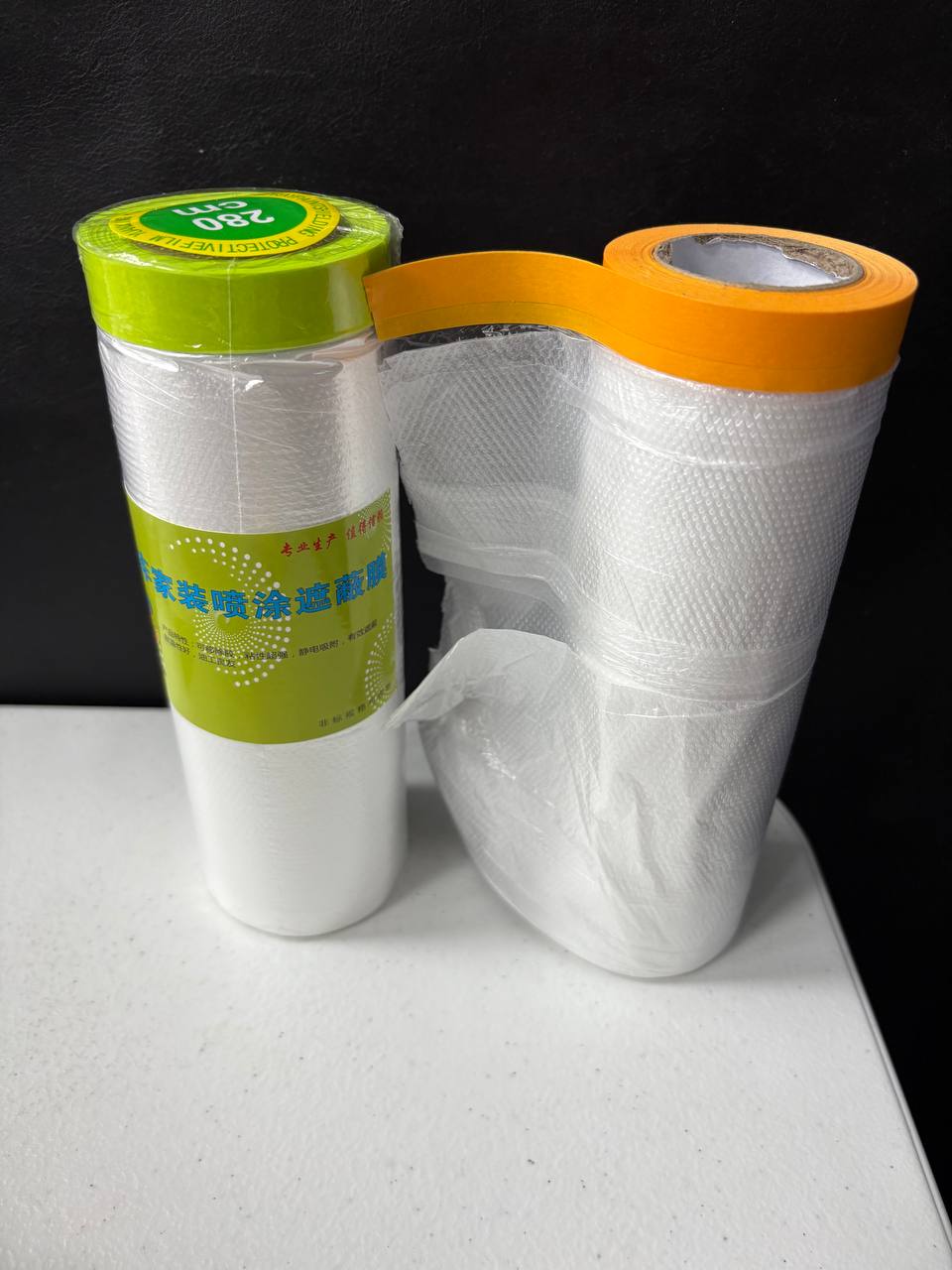 Pre-taped masking film